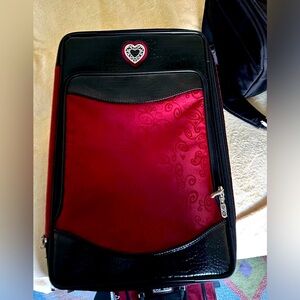 Brighton weekender, red with embossed black leather, silver hardware.